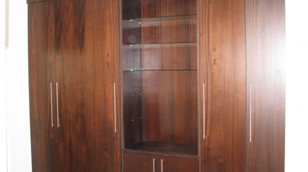 Converted wall unit featuring glass shelving